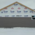 24.7   Siding on end of home almost ready for fascia and soffit